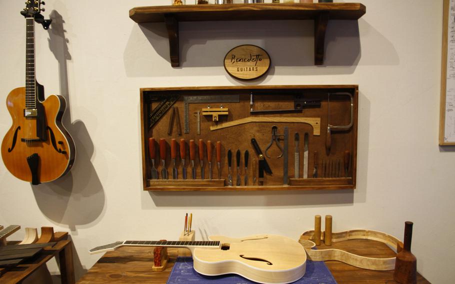 Most modern acoustic and electric guitars are factory made, but serious musicans seek out instruments made the old-fashioned way by luthiers in workshops such as this mockup at the museum exhibit.