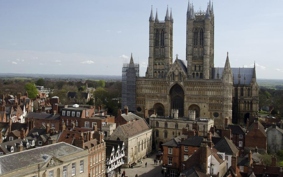 Lincoln Cathedral sits on a hill overlooking the central shopping district of Lincoln, England. The oldest part of the cathedral is thought to date to about 1100.