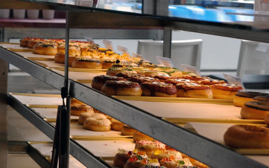 A variety of doughnuts is displayed at Happy Donazz in Kaiserslautern, Germany. The newly opened breakfast spot offers dozens of choices, along with muffins, bagels, coffee and other morning staples.