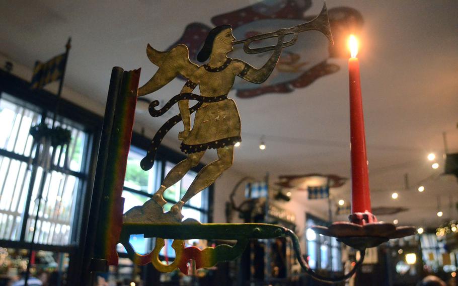 Candles and decorations add to the German atmosphere at Bierengel, a Bavarian restaurant in Cordenons, Italy.