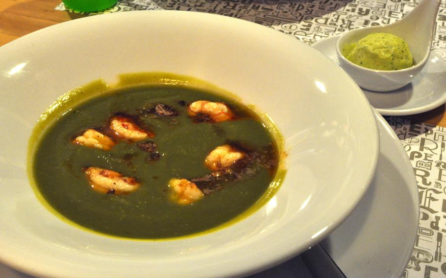 This zucchini soup served at Percosi Enogastronomici di Ricerca features shrimp. Diners are encouraged to drop the zucchini sorbet into the soup. It adds a level of sweetness without changing the temperature much.