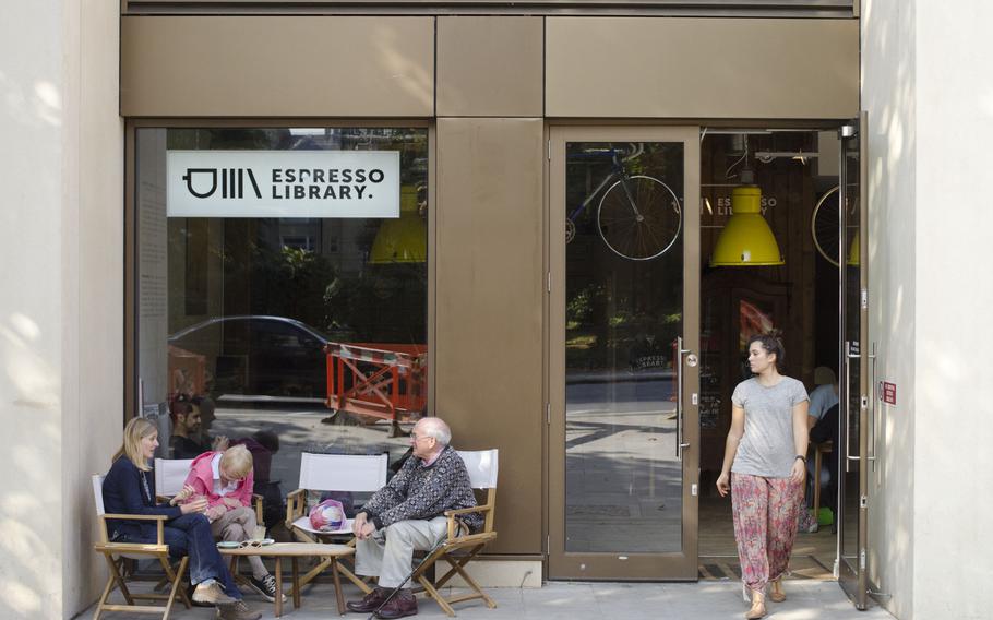 Customers drink outside of Espresso Library on Sunday, Oct. 4, 2015. The cafe opened in February near Parker's Piece in Cambridge, England. 

Adam L. Mathis/Stars and Stripes