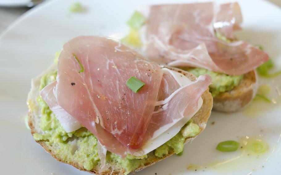 The mashed avocado and prosciutto at Espresso Library in Cambridge, England, comes on bread and is spiced with cayenne pepper. The Sunday menu favors healthier options, in keeping with the cafe's attempt to attract cyclists. 