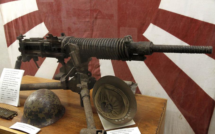 A Japanese Type 92 machine gun, dubbed the "woodpecker" by American troops because of its distinct sound, is among the relics displayed at the Pacific War Museum in Guam.