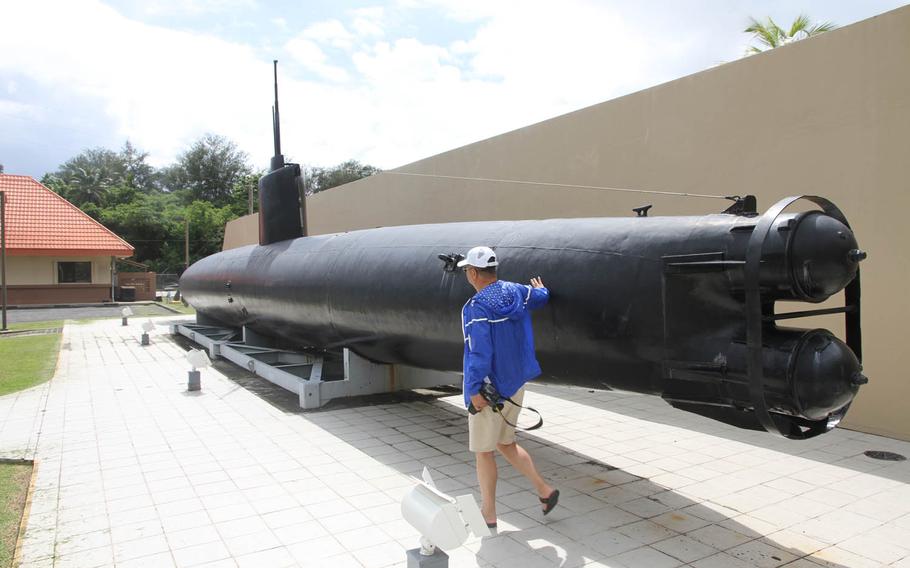A two-man Japanese submarine is displayed in front of the visitor center at the War in the Pacific National Historical Park Guam. The 80-foot sub ran aground in Guam in August 1944, a couple weeks after the Battle of Guam ended during World War II.