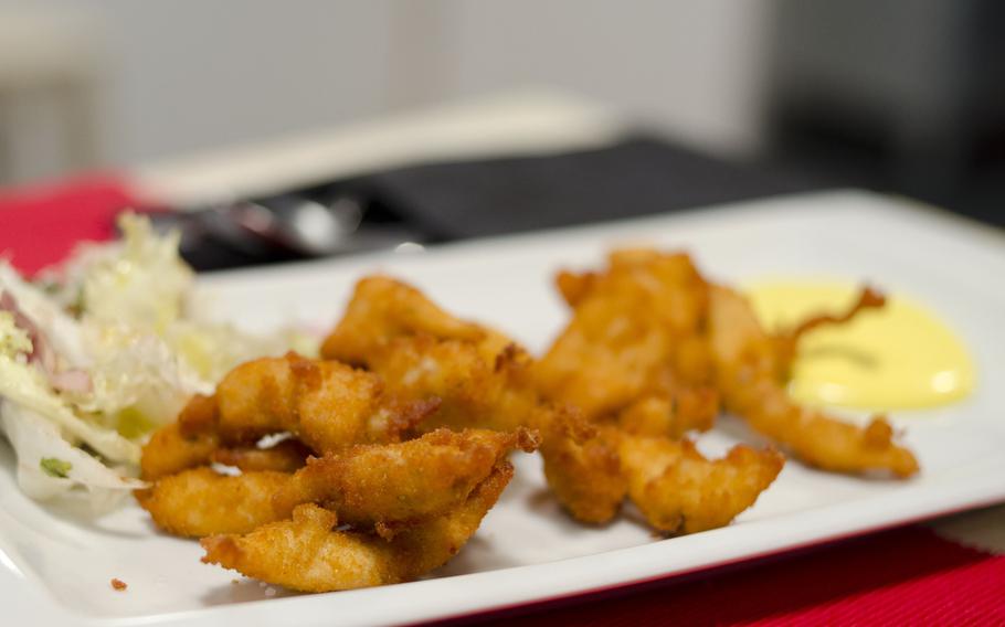 Chicken strips with ginger are one of the tapas options at Taperia Entrebares in El Puerto de Santa Maria, Spain. The restaurant also offers wines from nearby Cadiz.