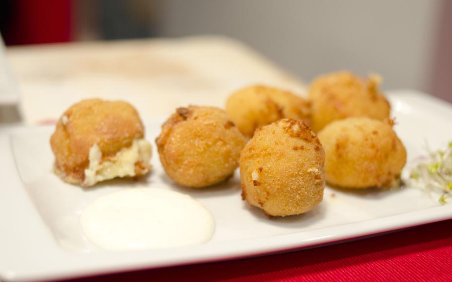 One of the offerings at Taperia Entrebares are croquettes made from four cheeses. The restaurant is located in El Puerto de Santa Maria, Spain.