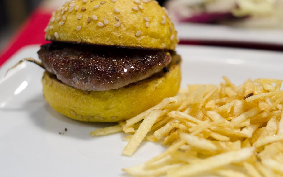 The lamb miniburger comes with thin-cut french fries at Taperia Entrebares in El Puerto de Santa Maria, Spain.