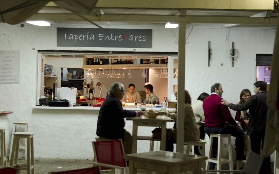 Guests sit in front of Taperia Entrebares in El Puerto de Santa Maria, Spain.The restaurant is located in a residential area of the city's westside.