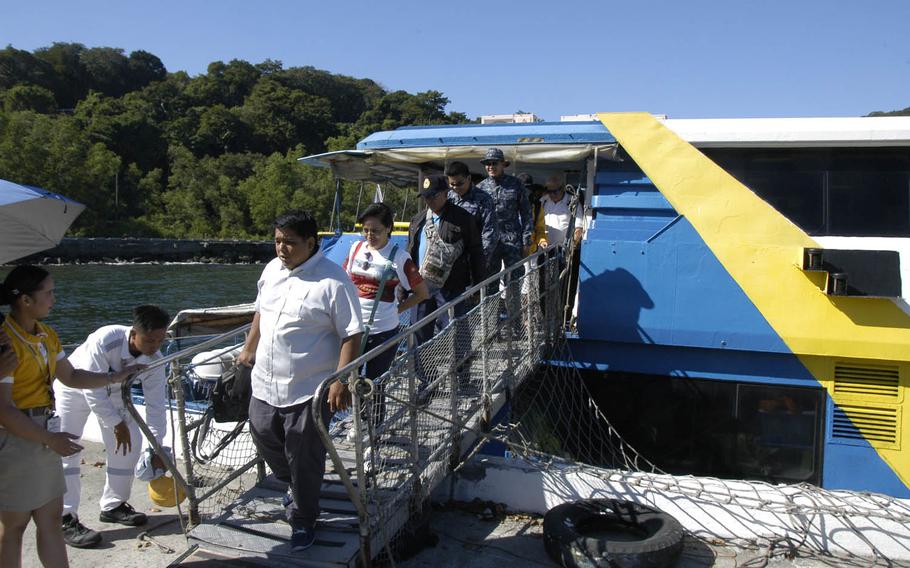 Visitors arrive at Corregidor Island in the Philippines after a short cruise from Manila.