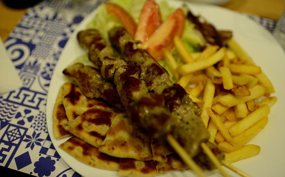 The souvlaki platter at La Piteria di Mykonos comes with fries and a salad.