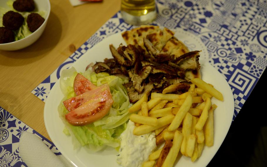 The pita platter at La Piteria di Mykonos, a Greek restaurant in the Vomero neighborhood of Naples, Italy, comes with fries and a salad.