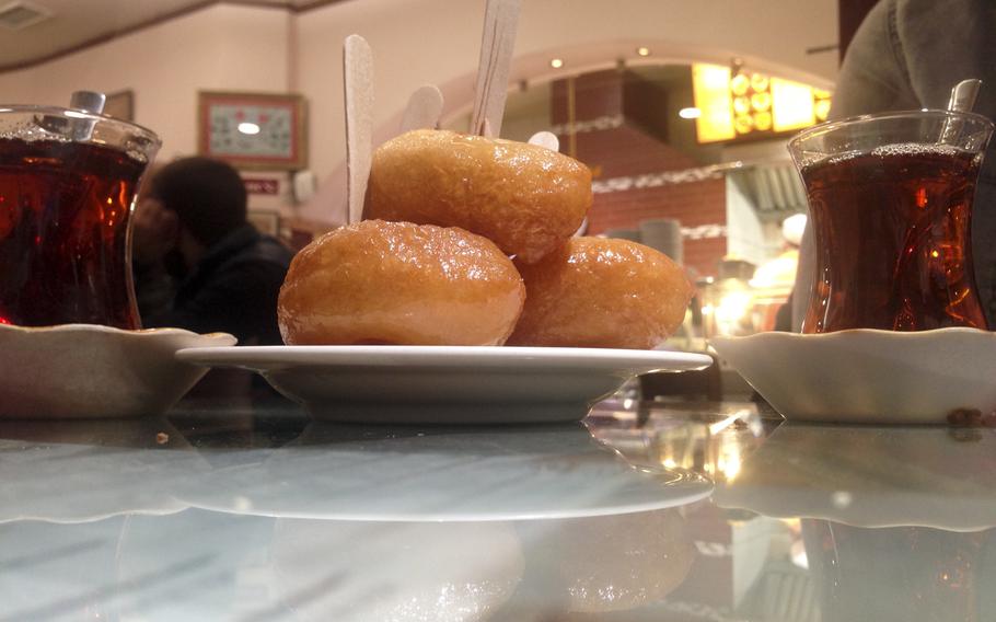 Harput Turkish Restaurant in Wiesbaden, Germany, offers for dessert a stack of lokma - a Turkish delicacy similar to a fritter, glazed with a sweet syrup - and chai tea. The lokma and tea are complimentary.