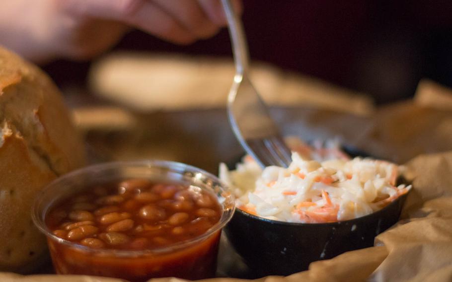 The menu at Boogie?s BBQ in Nuremberg, Germany, is simple. There are meats, a salad with meat and six side dishes, like these, baked beans and American-style coleslaw.