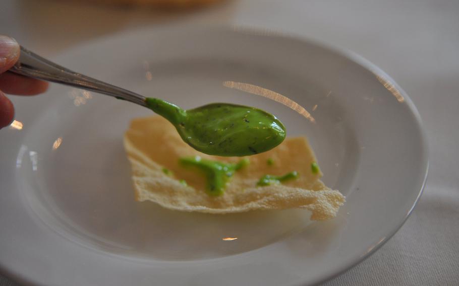 A creamy, bright-green mint sauce is served as a condiment with "papad" at the Curry House.