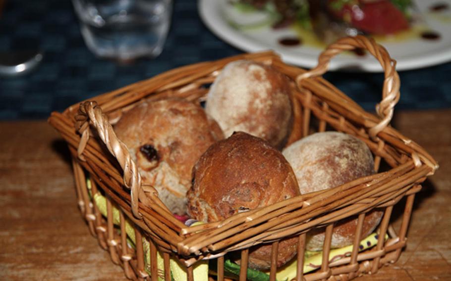 Fresh-baked bread satiates between courses at Gueuleton, a fine-dining restaurant tucked away in Okinawa City.