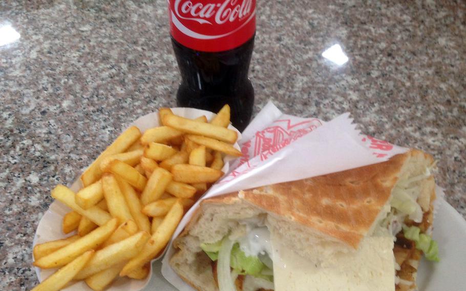 A doener kebab combo meal with fries and a Coke is served at Doener Time in Kaiserslautern, Germany. The eatery offers one of the area's best versions of the ubiquitous sandwich.