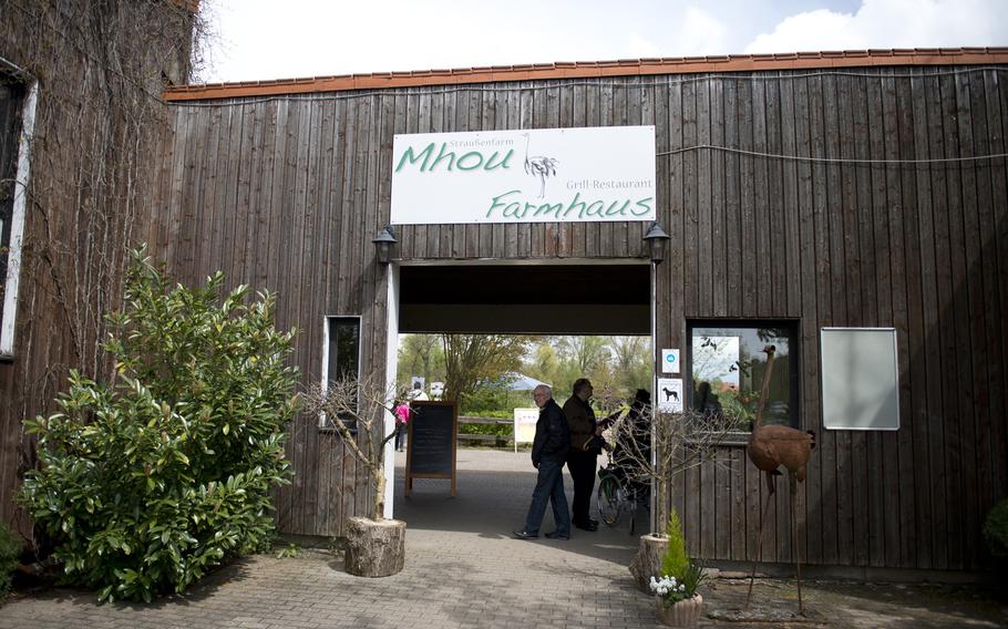 Visitors enter Ostrich Farm Mhou in Ruelzheim, Germany, April 24, 2016.