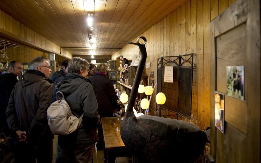 Visitors shop at the Ostrich Farm Mhou gift shop. The shop sells a variety of items such as decorated ostrich eggs, African art and even ostrich meat.