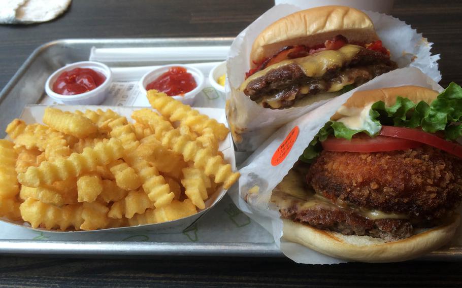 Two stacked burgers, fries and a brewed ice tea runs about $30 at Shake Shack’s popular new Ebisu location in Tokyo.