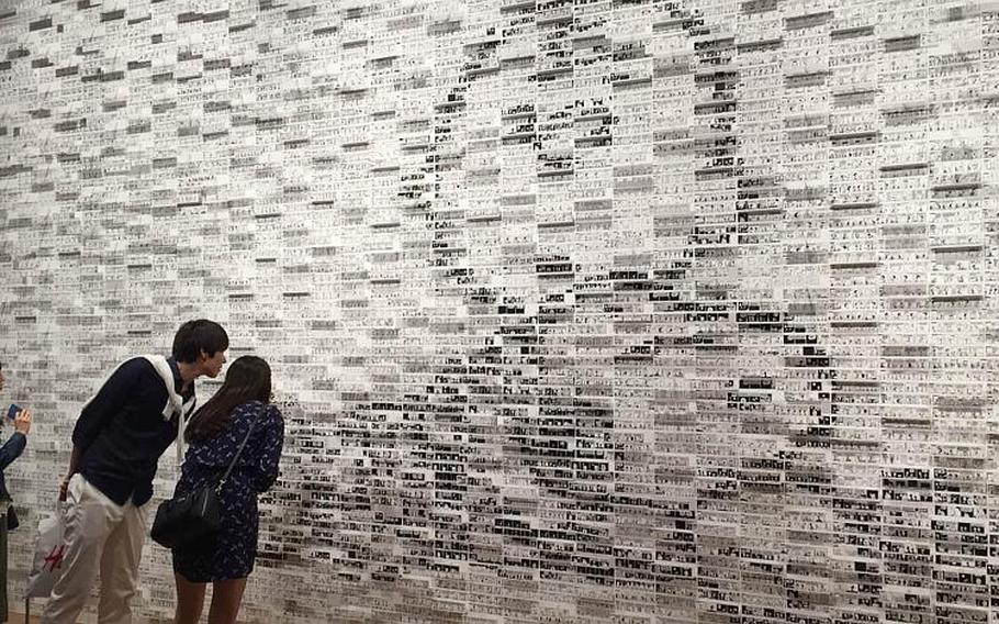 A giant mosaic of Charlie Brown and Snoopy made from thousands of "Peanuts" comic strips greets visitors at the Snoopy Museum Tokyo, Sunday, May 15, 2016. The temporary museum, which is an extension of the Charles M. Schulz Museum in Santa Rosa, Calif., opened in late April and will host various exhibits for the next two and a half years.