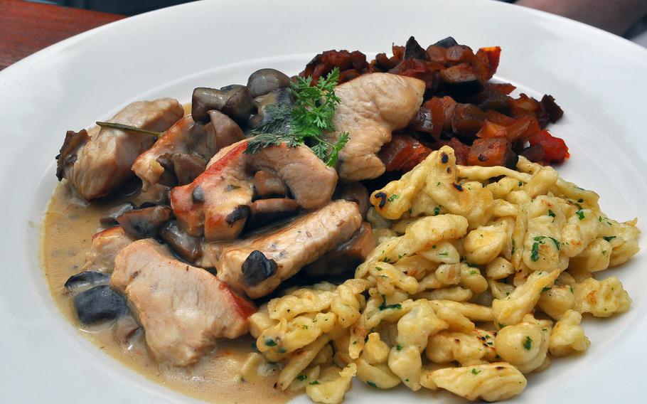 Turkey meat strips with spaetzle, mushrooms and diced vegetables makes for a hearty lunch at Proviantamt, a restaurant in the center of Mainz, Germany.