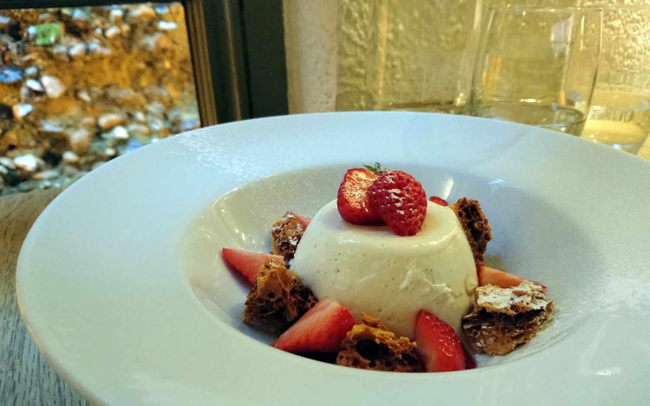 Vanilla panna cotta with strawberris and honeycomb at The One Bull, a pub in Bury St. Edmunds, England. Seasonal selections of desserts cost 6 pounds. 