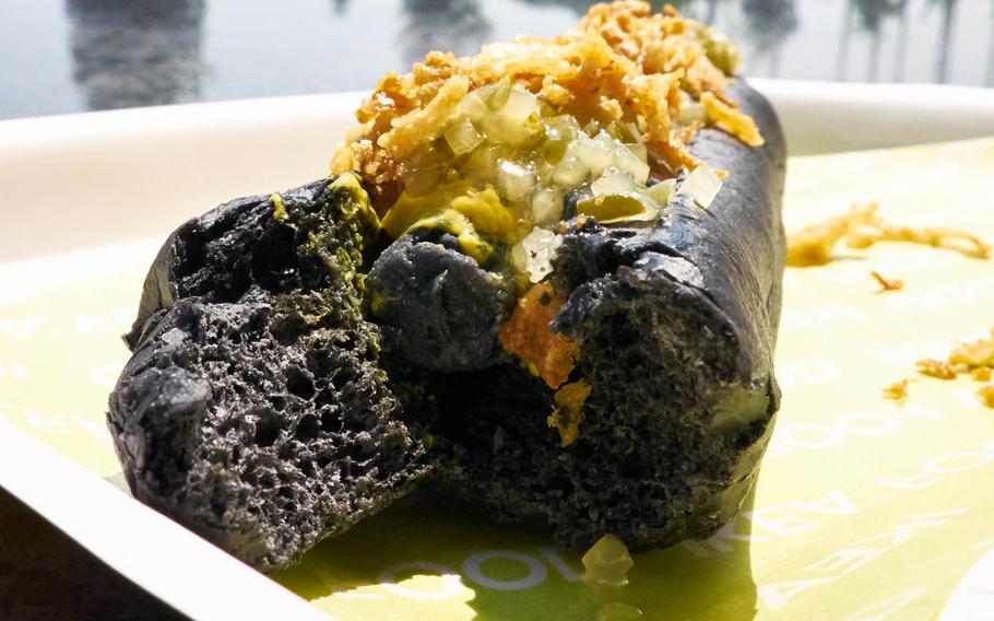 The bamboo charcoal smoke in the Ninja Dog from Ikea Japan gives the dish a strange greenish-black hue instead of a jet black look that squid ink-infused foods gain. The specialty item is being offered by the furniture giant through the end of the year.