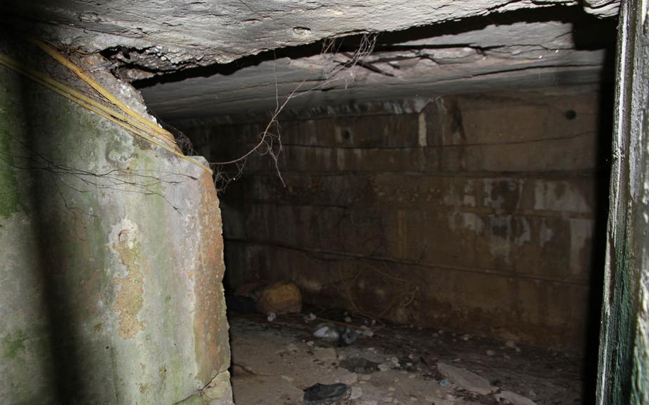 A photo taken through the bars blocking entry into Imperial Japan's 32nd Army underground headquarters on the Shurijo Castle grounds in Okinawa, Japan.