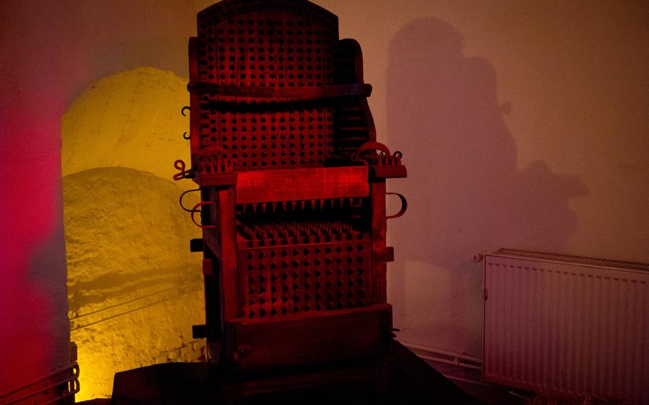 An inquisition chair from the 17th century is on display. Prisoners were interrogated in the chair while naked. The interrogator could exacerbate their pain by forcing their arms and legs down, or by rocking the chair.