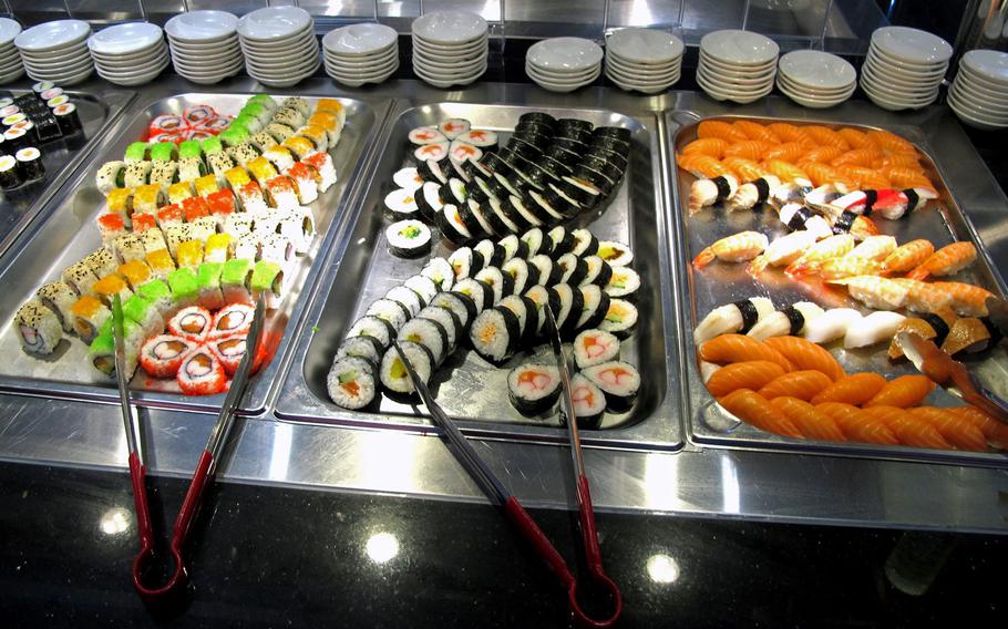 A generous collection of sushi is presented as part of the Asian buffet at Gourmet Tempel.