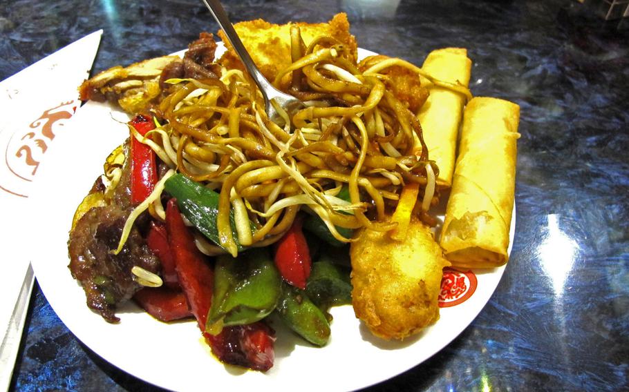 A heaping portion of items from the buffet reaches a table at Gourmet Tempel restaurant in Kaiserslautern, Germany.