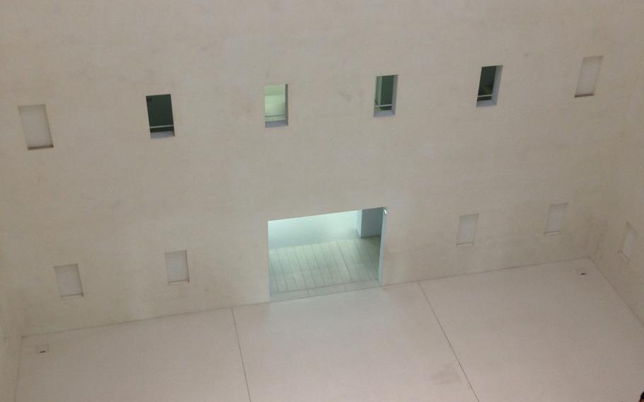 The inside core of the Stuttgart public library is empty space intended to give a feeling of tranquility. Sections with books curl around the perimeter.