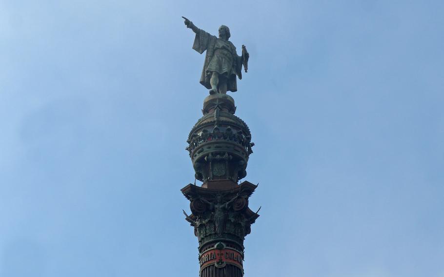 A statue of Christopher Columbus tops the Mirador de Colom, a monument to the explorer on a square at the seaside end of Las Ramblas in Barcelona, Spain.