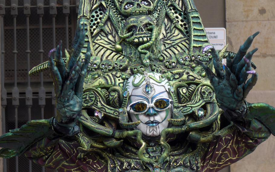 One of the scarier human statues on Las Ramblas in Barcelona, Spain. The pedestrian area is often filled with street artists, from the comedic to the ornate and artistic.