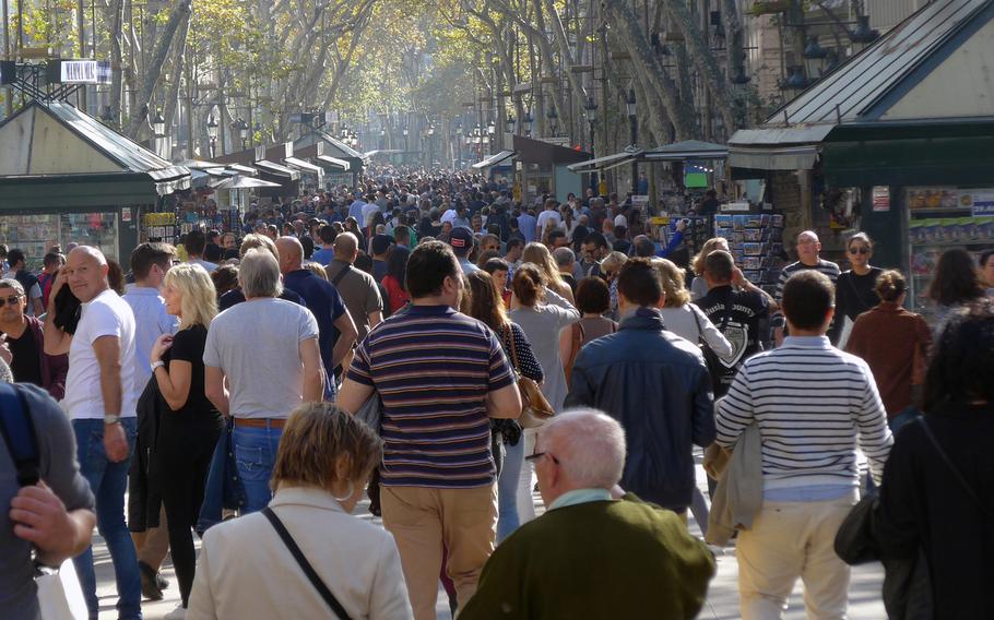 Walking along Las Ramblas, heading away from Placa de Catalunya.