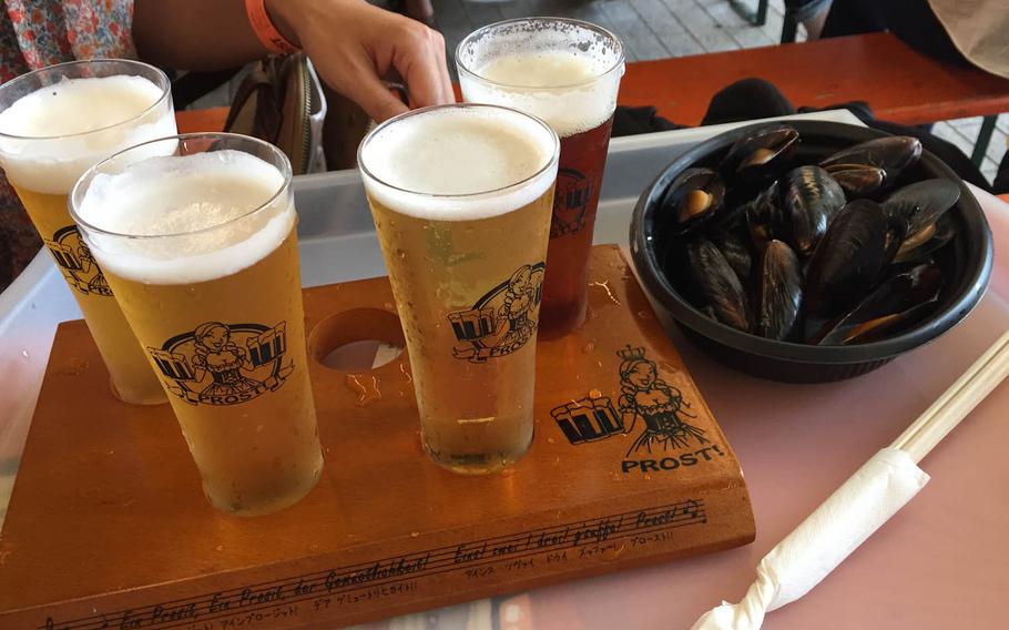 A flight of beer and a bowl of mussels at the Yokohama Oktoberfest, Tuesday, Oct. 4, 2016. The event, which runs through Oct. 16 beside the oceanfront Red Brick Warehouse shopping complex, isn't the only Oktoberfest event in Japan, but it's one of the best.