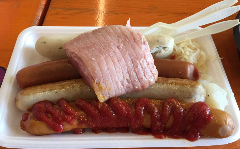 A platter of sausages, mashed potatoes and sauerkraut at the Yokohama Oktoberfest, Tuesday, Oct. 4, 2016.