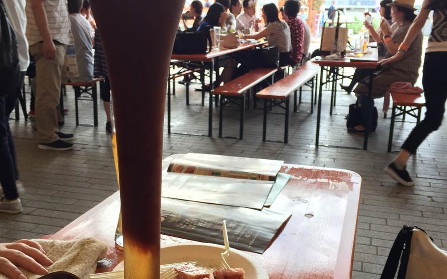 Beer sizes range from big to small at the Yokohama Oktoberfest. The annual event runs through Oct. 16 beside the oceanfront Red Brick Warehouse shopping complex in Yokohama, Japan.