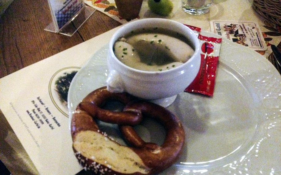 One appetizer option at Brauhaus Castel in Mainz-Kastel, Germany, is a pair of Bavarian veal sausages and a warm, soft pretzel served with sweet mustard.