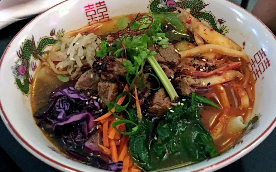 This noodle soup, with beef, vegetables and thick noodles, was served in a gingery broth. Eat Drink, Man Woman is the only Korean restaurant in Stuttgart, Germany.