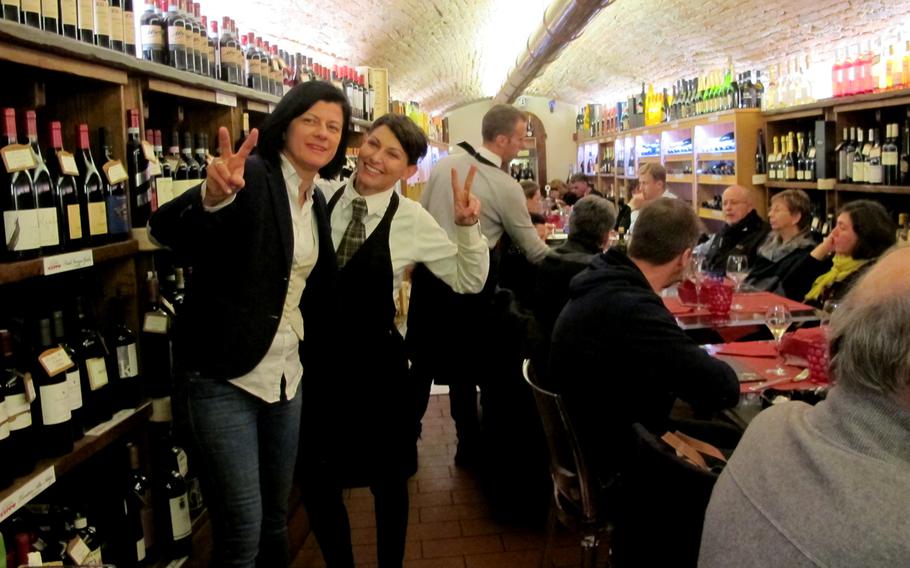 Diners sample regional dishes in the dining room-wine cellar. Ivana Boscolo, left, and Eva Folletto wait tables, make wine recommendations, slice salami and help shoppers choose an olive oil, cheese, or take-out entree.