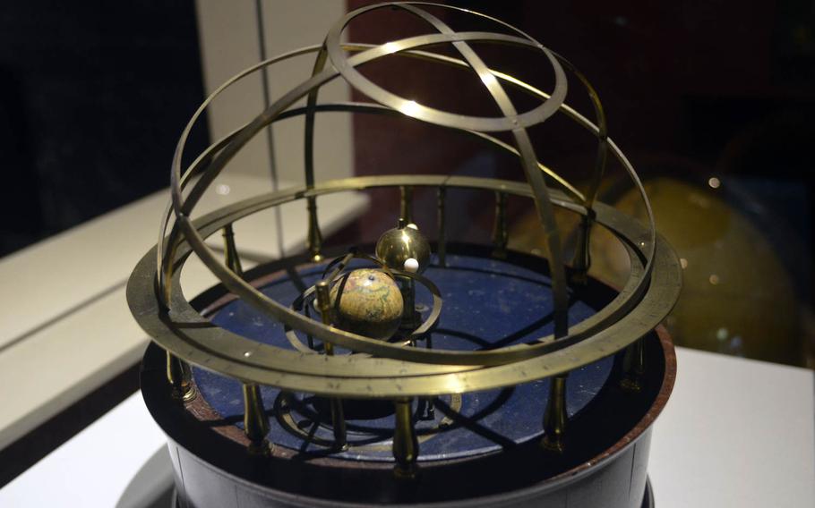 A table orrery displayed at the Whipple Museum. An orrery is a mechanical model of the Sun, Earth, Moon, or other planets used in demonstrating concepts such as day and night or the seasons and eclipses.