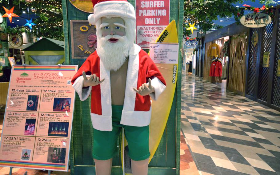 Hawaii Town in Yokohama, Japan, celebrates Christmas with a surfer-style Santa Claus.