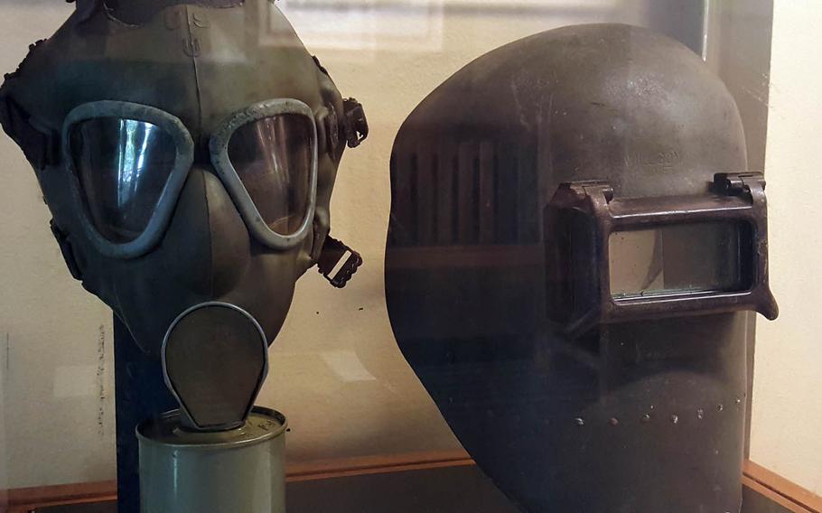 With memories of poison gas from World War I, officials distributed gas masks such as the one on the left to all Hawaiians older than 7. Of far more practical use during World War II, however, was the welding mask, right, used by workers repairing the decimated Pacific fleet and building newer ships.