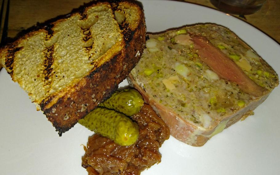 One of the starters at the Pea Porridge restaurant is a terrine of veal, pigeon, pistachio and foie gras with chutney, pickles and a toast appetizer . Dinner menu starters are 7.50- 9.75 pounds ($9.25-12).