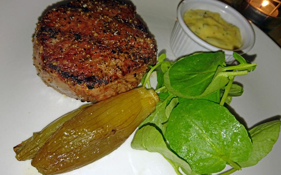 A 28-day aged Aberdeen Angus steak with shallot confit is one of the entrees served at the Pea Porridge restaurant in Bury St. Edmunds, England.The steak was cooked on a special wood-fired grill.