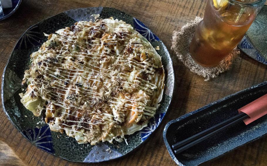 Ai Kaze's restaurant offers Okonomiyaki, a savory dish consisting of cabbage, flour, eggs and fish.