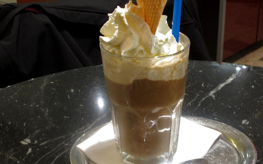 An iced coffee with whipped cream and a crispy waffle is served at Eiscafe Dolomiten in Kaiserslautern, Germany.