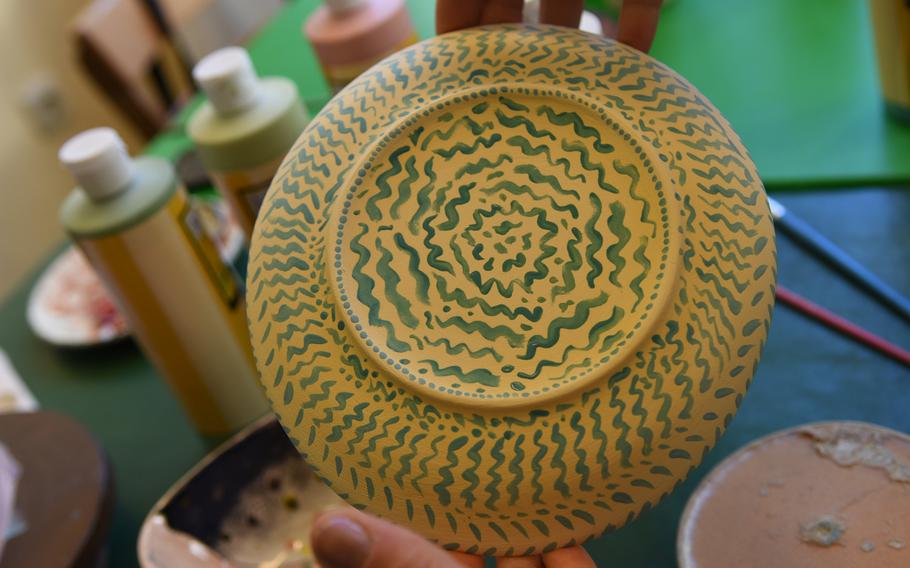 Little tiny blue swirls, resembling waves, add a special touch to a hand-painted dish at Mal-Werk, a paint-your-own pottery shop and cafe in Mainz, Germany.